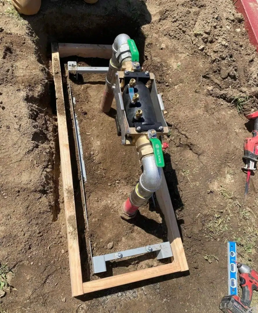 Repair work on a backflow prevention assembly.